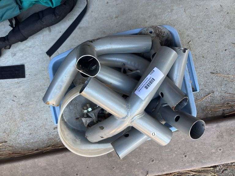 Parts and pieces for a carport or tent frame. image