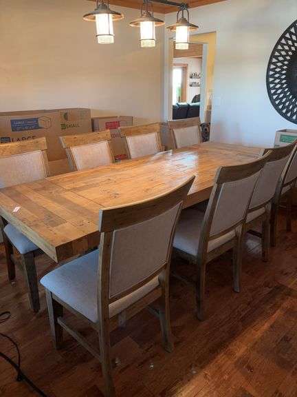 Wood table, 8 fabric high back chairs, 16” ends or leafs remove and can be stored. With leafs on ends table measured 63” long x 39 1/2 wide image