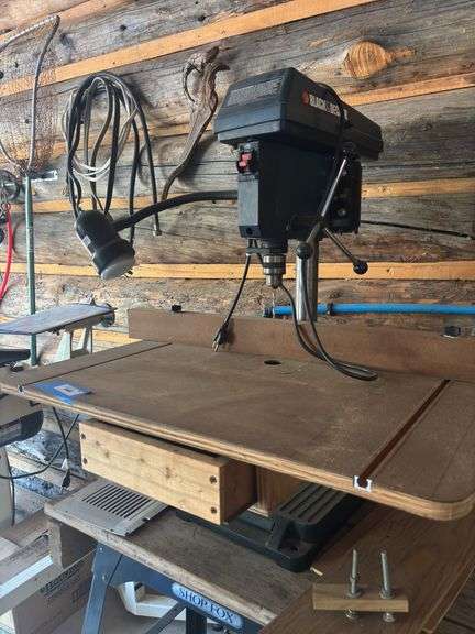Black & Decker tabletop drill press with precision table top and light image