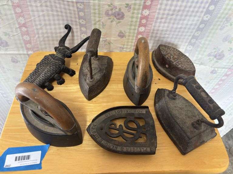 Five sad irons, bootjack, and trivet image