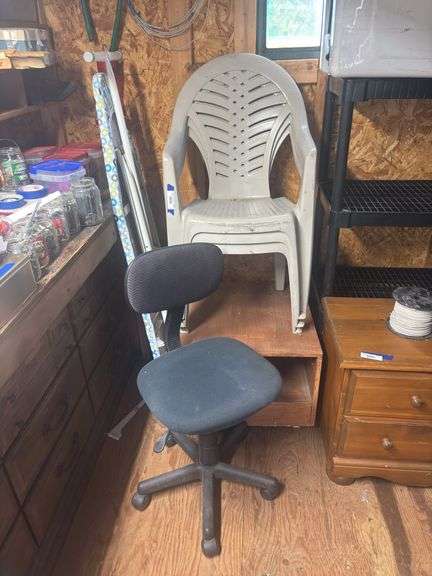 Desk chair, ironing board, three plastic￼ chairs and cart image