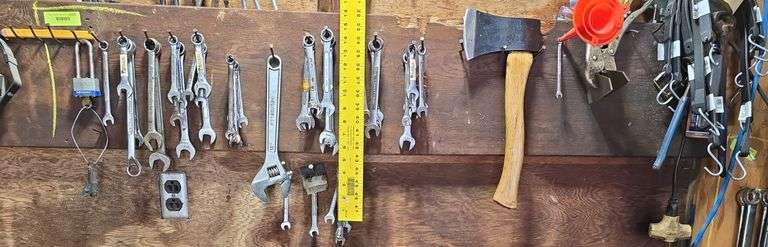 Combination wrenches, hatchet, rubber tarp straps, funnels, vise grip image