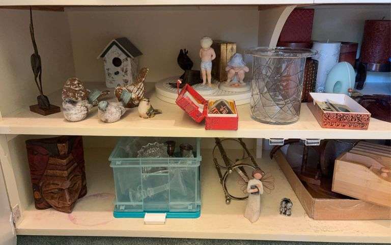 Decor includes Willow Tree, candles, Frances Hook children’s figurines, candle holders, wooden masks, etc “D” cupboards image
