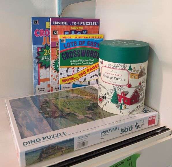 Crossword puzzle books, two jigsaw puzzles and a drawer full of playing cards image