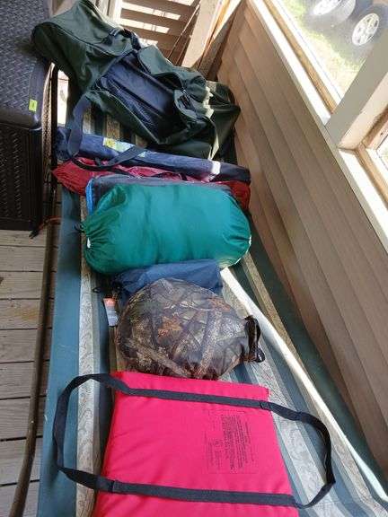 2 bag chairs, sleeping bag, flex core air mattress, camp pad, flotation device, camo pillow and huge Cabekas rolling duffelbag image