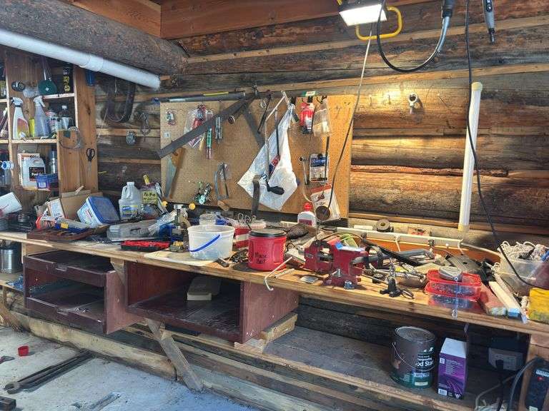 Entire contents of workbench items on pegboard and all items around the garage wall image