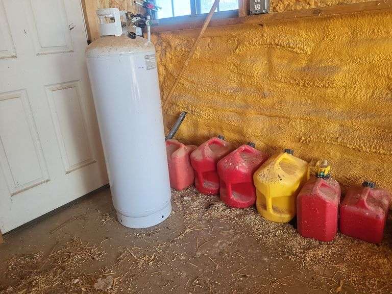 100lb propane tank with  gas can image