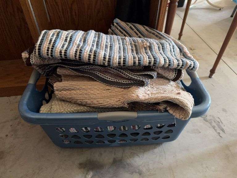 Laundry basket of all kinds of rugs image