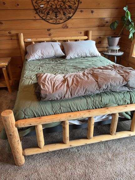 Queen log bed with bedding, weighted throw, some stains on mattress image