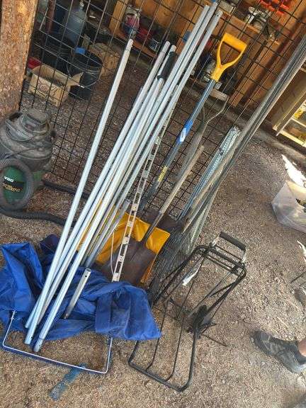 Assorted yard tools, and snow shovels image