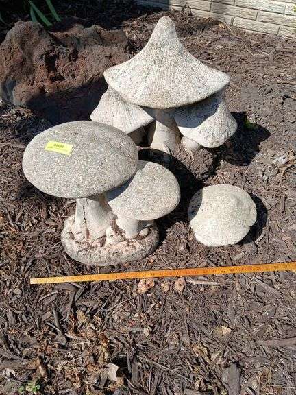 Three cement mushrooms image