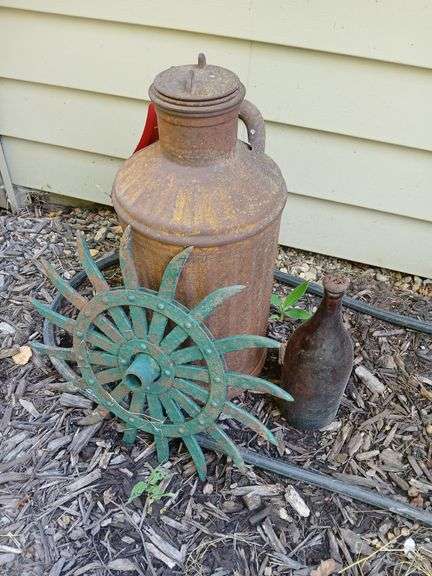 Rotary hoe wheel, Davis Welding Co gas can, brown glass bottle image
