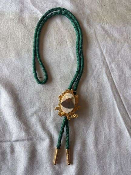 Alaskan gold nugget with ulu bolo on nylon cord image