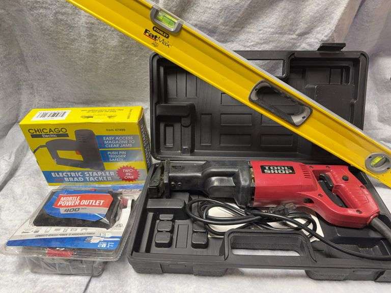 Lot with Stanley 4-ft level, Tool Shop corded reciprocating saw, mobile power converter (12VDC to 120VAC, 400W) and Chicago Electric stapler. image