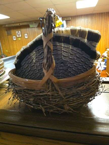 Unique woven basket and two quail tail? fans image