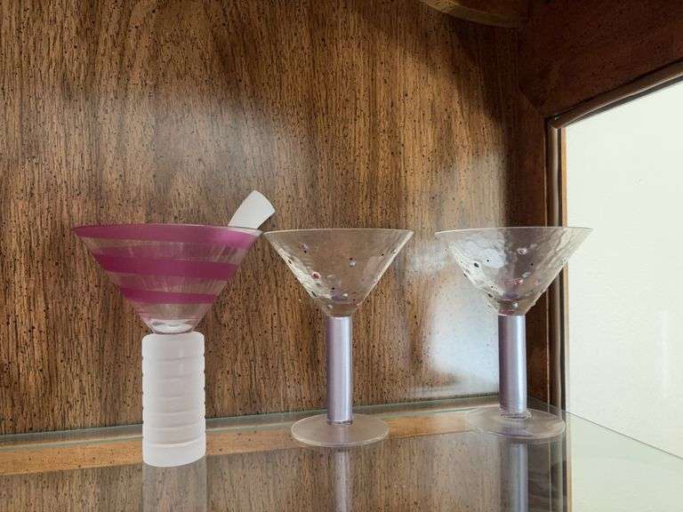 A pair of martini glasses for the happy couple and one for the third wheel image