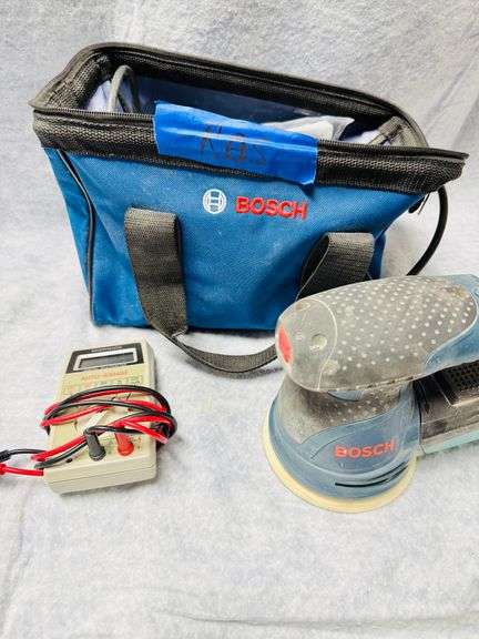 Lot consisting of a 2-ton floor jack, appears unused, open and box end wrenches 1/4 through 15/16 (18), Auto range digital voltmeter, Bosch orbital sander, 5" dia, 8 hole, in bag. image