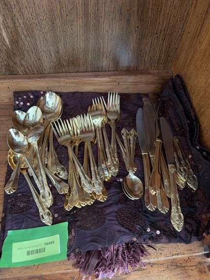 Unsorted & unmatched gold flatware image