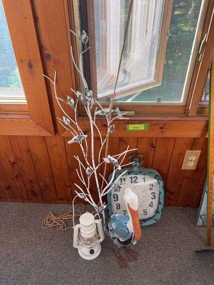 LED lantern, “antiqued clock", a pelican and some leaves image