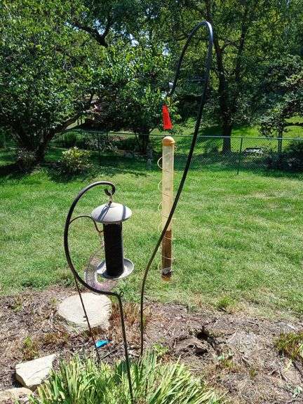 Three shepherds hooks with birdfeeders image