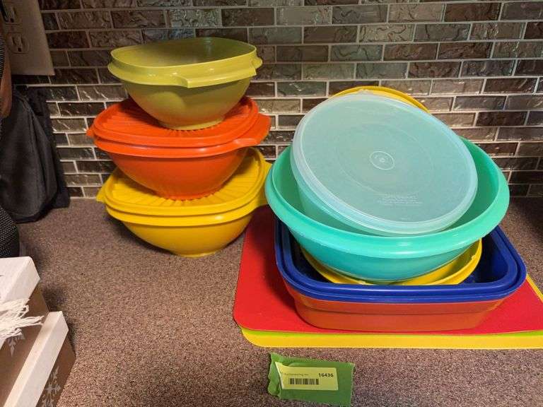 Tupperware storage containers and plastic cutting mats image