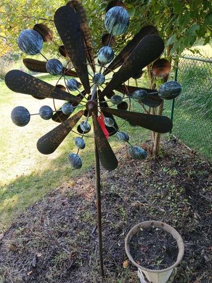 Double sided metal whirly gig and metal planter image