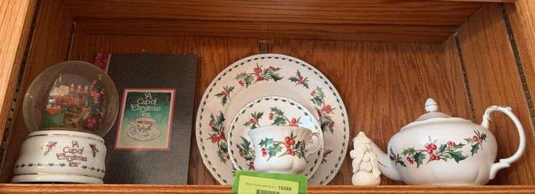 A cup of Christmas tea book, tea set and snow globe image