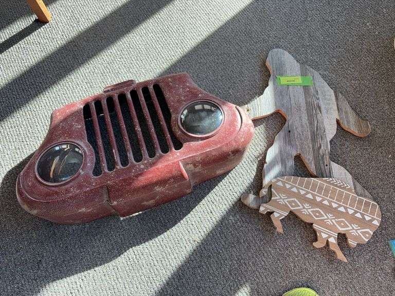 Man cave decor-Sasquatch w a broken hand, horseshoes w nails, man cave sign, “car” grill w LED lights and a buffalo w a missing foot image