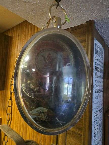 Classic Budweiser 13 x 22 +/- oval rotating clock w/ beer mug and bottle picture opposite side Does light up image