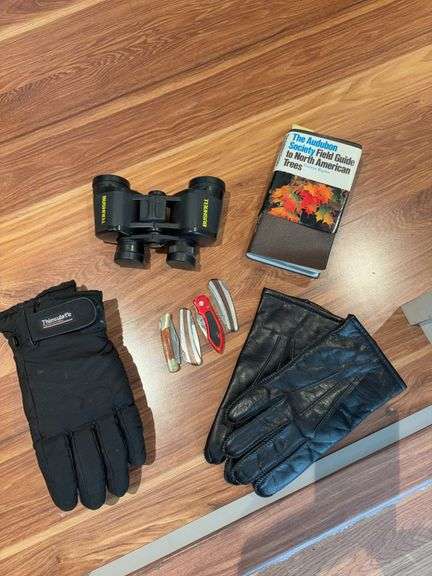 Bushnell binoculars, pocket knives, gloves and book image