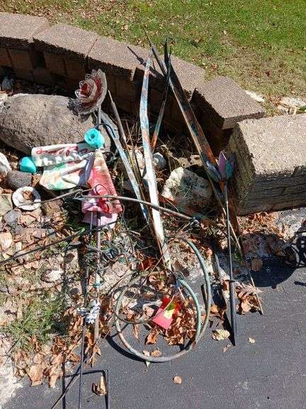 Various yard decor includes flag holders, decorative flowers, etc image