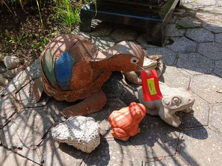 Metal turtle, cement sponge and three frogs image