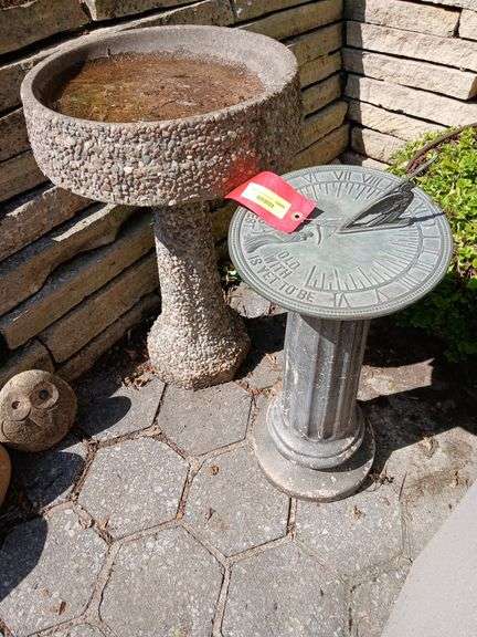 Cement bird bath 16R x 27H and a sundial on a bird bath base image