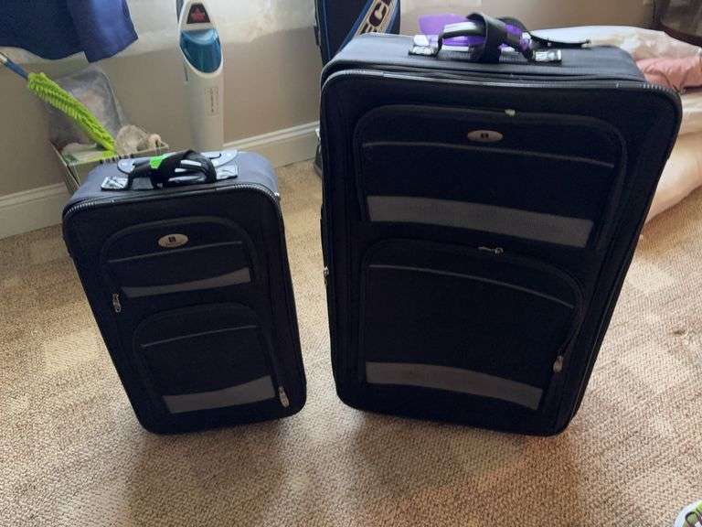 Pair of Leisure brand rolling suitcases image