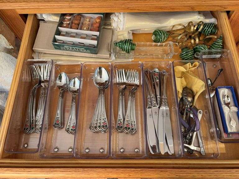 Drawer of holiday flatware, spreaders, napkin holders, etc image