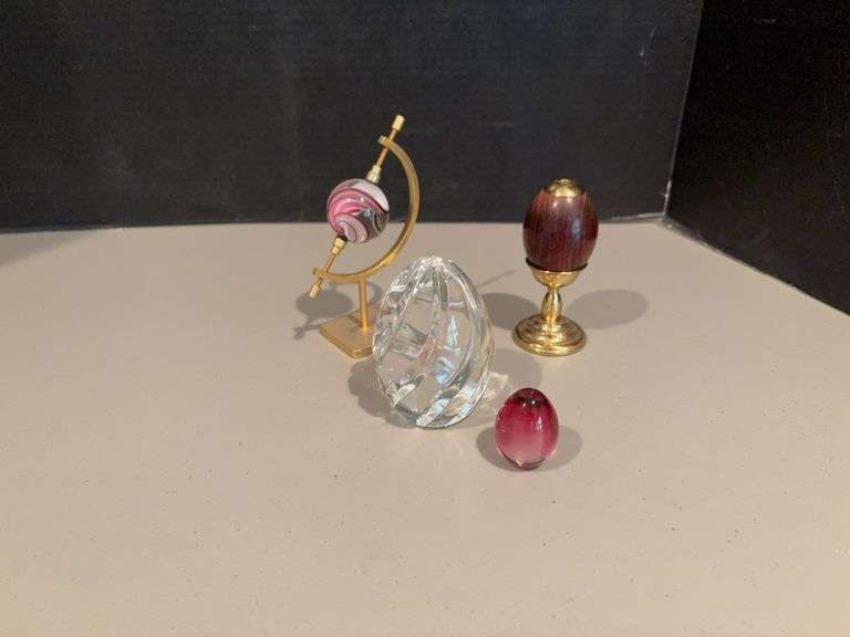 Four glass “eggs” all sizes and colors image