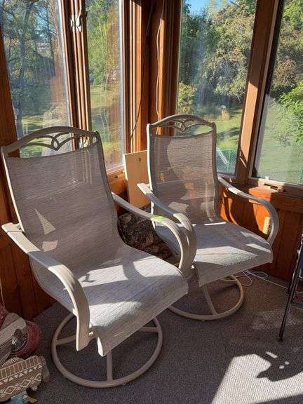 Two rocking stationary patio chairs image