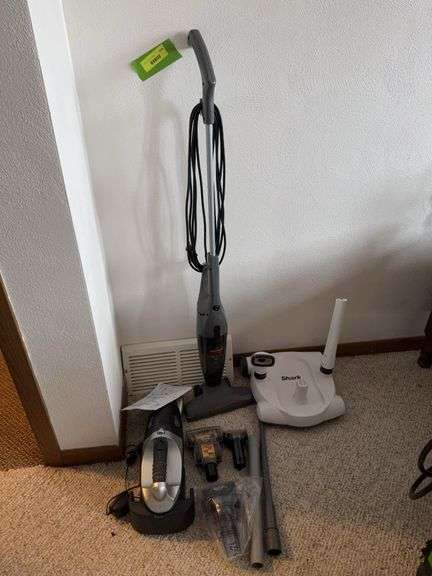 Bissell 3 in 1 stick vac and Shark hand vac image