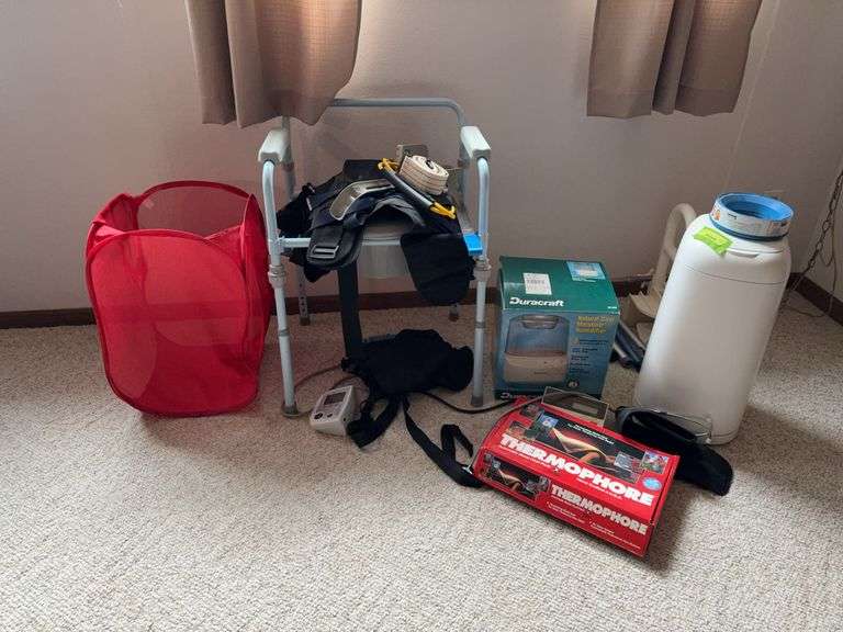 Misc medical related equipment includes toilet chair, blood pressure cuffs, tub handle, diaper keeper, heating pad, room humidifier etc... image