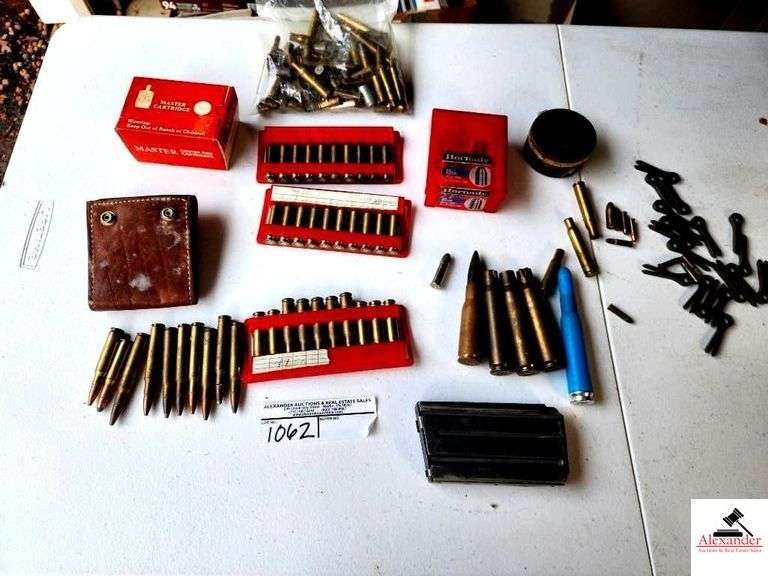 LEATHER SHELL POUCH-3-30 06 CARTRIDGES SOFT POINT 308 SPENT BRASS-HORNADY 45 CAL MUZZLELOADING AMMO-5 LIVE ROUNDS OF SOFT PINT AMMO-MASTER 38 SPECIAL SPENT BRASS-CAN OF PRIMERS-MISC LIVE ROUNDS-BAGS OF MISC BRASS RIFLE CARTRIDGES-LARGE CALIBER SPENT BRASS-AR 15 MAGAZINE CLIP-15 LIVE RIFLE SHELLS(GARAGE) image