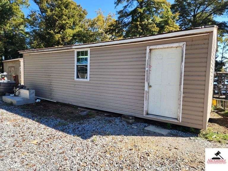 PORTABLE BUILDING (TAN COLOR ) 12'X30' USED AS SHOP - FRONT DOOR & OVERHEAD END DOOR