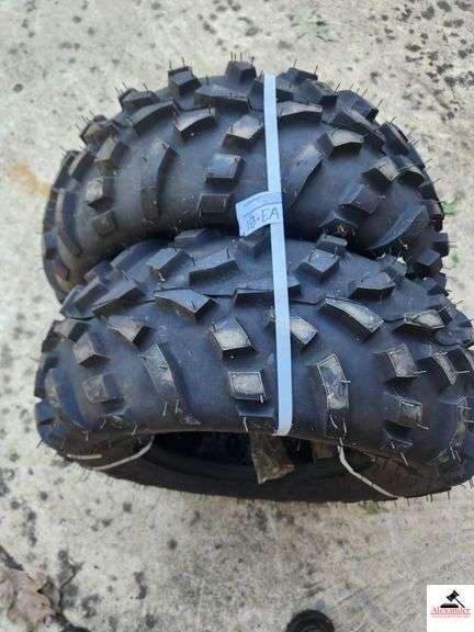 185489 CARLISE TRACTION TIRES (2) - 8T25-10- 2 (APPEAR NEW WITH RUBBER TABS AND BANDED)