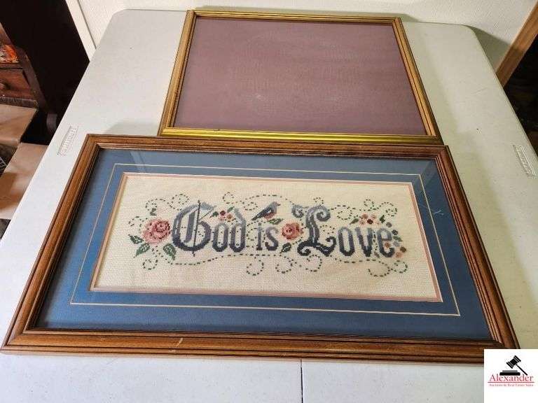 GOLD PICTURE FRAME WITH GLASS AND BACKING CROSS STITCH PIECE WORK "GOD IS LOVE" WITH BLUE BACKING IN WOODEN FRAME (TRAILER) image