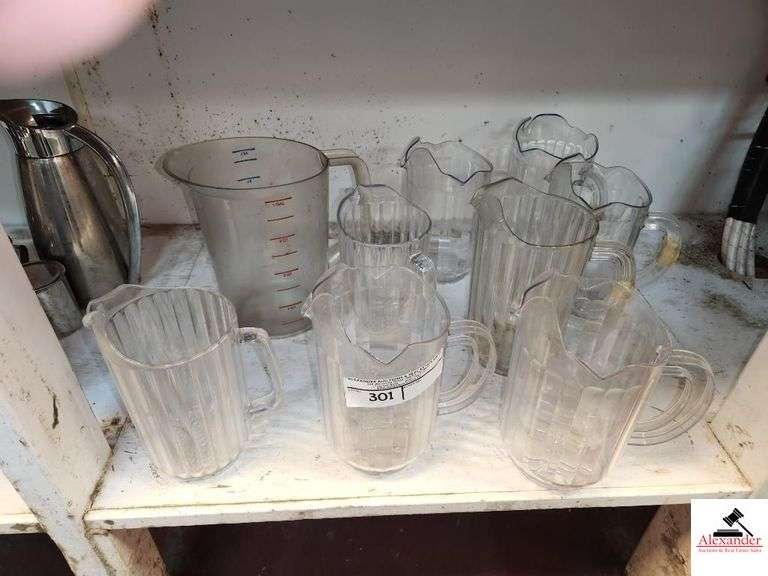 (8) PLASTIC DRINK PITCHERS-(1) LARGE PLASTIC MEASURING PITCHER image