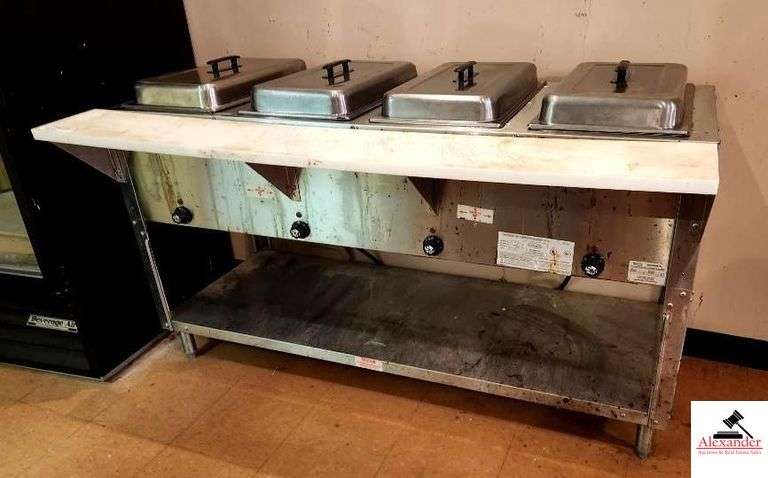STAINLESS WATERLESS FOOD WARMER/FOOD TABLE W/ SECTIONAL INFINTE SWITCH CONTROL-4 PANS - 4 LIDS - 4 CONTROLS -62"X24"X34"- - 4 COMPARTMENTS - 8" CUTTING BOARD (UPSTAIRS) image