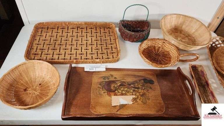 WOOD SERVING TRAY - ONE RIM NEEDS GLUING BACK ON - SERVING BASKETS, SOME SHOW WEAR - SERVING TRAY HAS PIECE OF TAPE ON IT - GLASS LIDS - SERVING RACK - ROUND WOVEN BASKET WITH LID - SHOWS WEAR - (UTILITY ROOM)