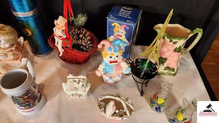 JESTER MUSICAL HANDPAINTED HANDCRAFTED CERAMIC ROATATING MUSIC BOX - SMALL BLOND HAIR DOLL MUSIC BOX MAY NOT PLAY - INSCENT HANDPAINTED DUCKS CHINA - UCAGO HANDPAINTED BIRD VASE - FIREPLACE MATCH BOX - BASKET DECORATIVE - MINI HATS - HANDPAINTED PITCHER BOTTOM MISSING - VINEGAR AND OIL CRUETS HANDPAINTED BOTTOMS BROKE ON ONE - HANDS WITH BIBLE VERSE - BUDWEISER SEASON GREETING CUPS - BASKETS - METAL TISSUE BOX - MISCELLANEOUS - (GREAT ROOM CABINETS)