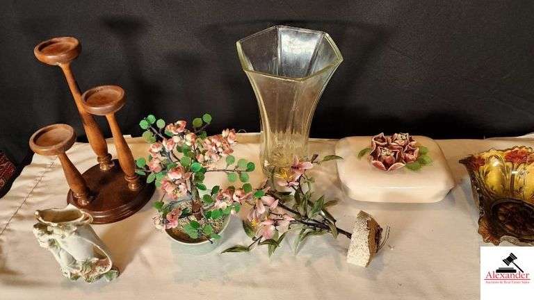 RUBBER LEAF FLOWERS - WOOD CANDLE STAND - DRESSER BOX WITH APPLIED FLOWERS - ONE LEAF BROKEN OFF - VASE WITH LADY - CLEAR GLASS VASE - GOOFUS GLASS BOWL NEEDS REPAIR RIM BROKEN - (GREAT ROOM CABINETS)
