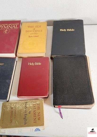HOLY BIBLES AND HYMNALS - UNITED METHODIST HYMNALS - THE NEW TESTAMENT IN MODERN ENGLISH TRANSLATED BY J.B PHILLIPS SOME PAGES OFF OF THE SEAM - THIS SIDE OF INNOCENCE BY TAYLOR CALDWELL COPYRIGHT 1946 - ONE BIBLE COVER UNATTACHED - HOLY BIBLE KING JAMES VERSIONS - (TRAILER)