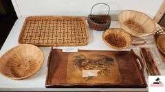 WOOD SERVING TRAY - ONE RIM NEEDS GLUING BACK ON - SERVING BASKETS, SOME SHOW WEAR - SERVING TRAY HAS PIECE OF TAPE ON IT - GLASS LIDS - SERVING RACK - ROUND WOVEN BASKET WITH LID - SHOWS WEAR - (UTILITY ROOM)